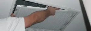 Man changing air filter